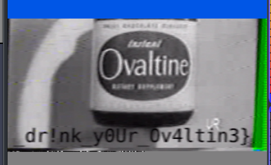 Screenshot of grainy black and white video featuring a can of ovaltine and half of the CTF flag overtop