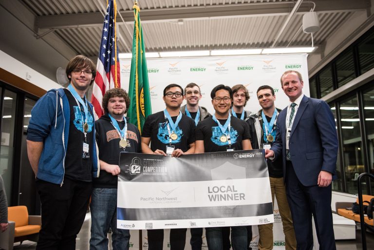 Victory photo of 6 OSUSEC students as well as Yeongjin Jang, and a representative from the Department of Energy.