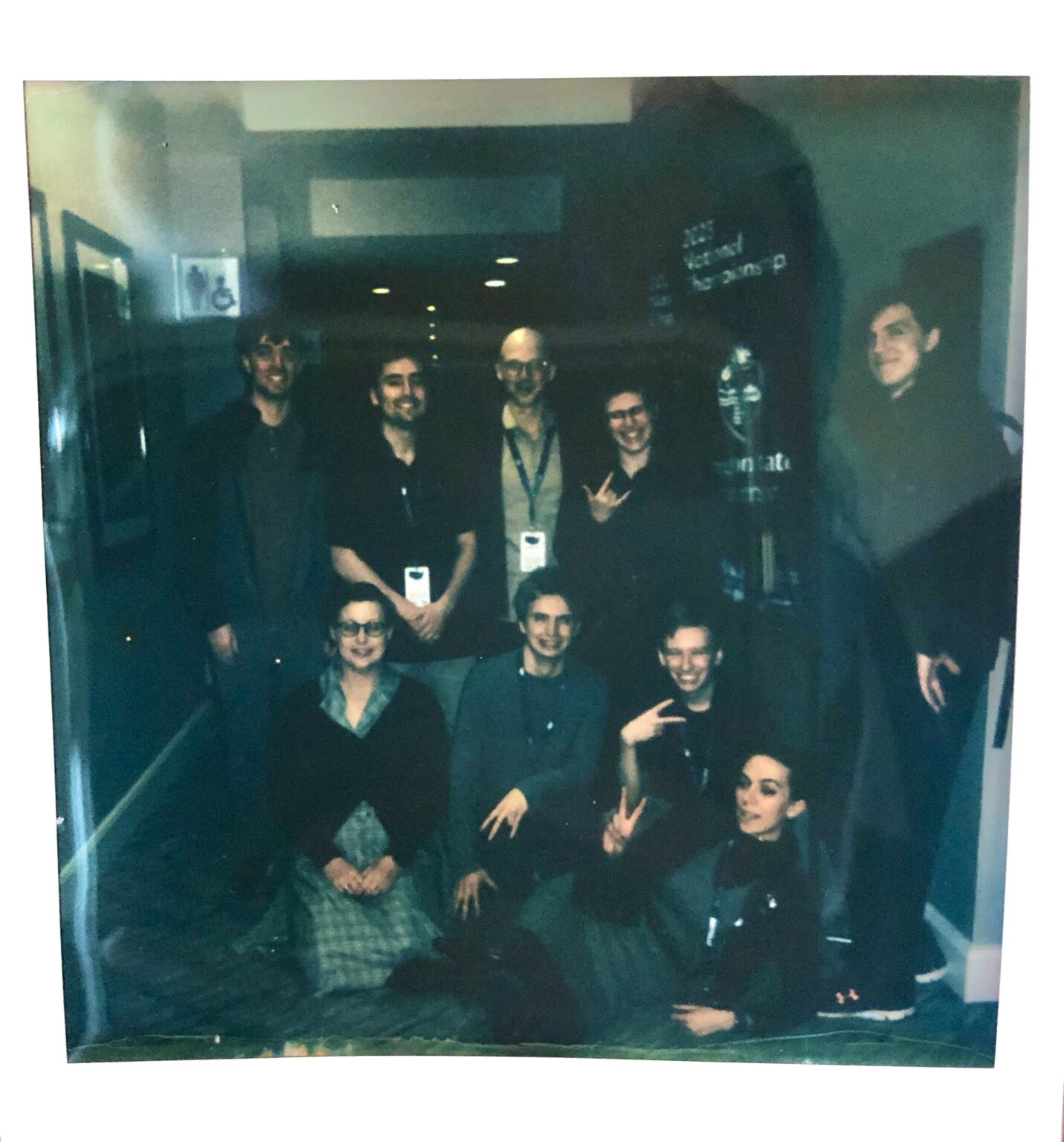 Polaroid picture of OSUSEC’s CDC team posing by the school flag